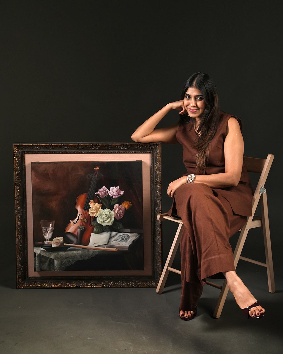 Contemporary artist posing with framed canvas painting-piture art.